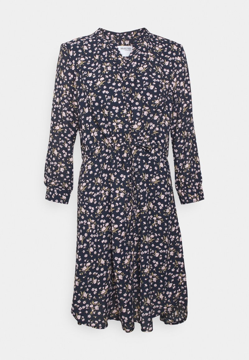 Robe midi florale bleu marine à manches longues, avec un col et une ceinture à nouer. Présente de petites fleurs roses et blanches sur l'ensemble.