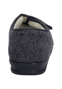 Gray wool slipper with a textured surface, soft inner lining, and sturdy black outsole. Features a low back and slip-on design.