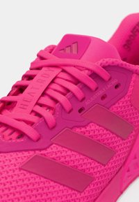 Bright pink athletic shoe with mesh upper, adjustable lacing system, and rubber sole. Features three distinct side stripes.
