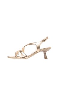 Metallic gold sandals with an open toe, featuring three crossed straps and an adjustable ankle buckle, on a short, block heel.