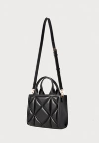 Black leather handbag with a quilted pattern, featuring dual top handles and a detachable shoulder strap. Gold hardware accents.