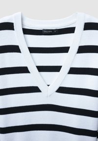 White knit sweater with black horizontal stripes and a V-neck collar, size small, brand label "Calliope" visible.