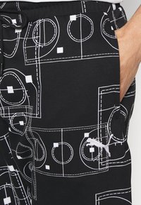 Puma Träningsbyxor - black