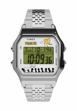 Digital Timex watch with gray metal band, rectangular case, green display, "Peanuts" logo, and character silhouettes along the bottom.