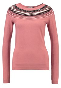 Pull rose en tricot présentant des manches longues et un empiècement à motif noir et blanc. Texture douce avec des poignets et un ourlet côtelés.