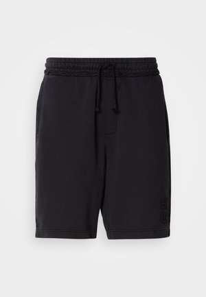 Mustad mustriga lühikesed püksid elastse vöökoha ja nööriga. Omab küljetaskuid ja diskreetset sissepressitud brändingut alumises vasakus jalas.