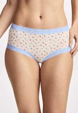 Woman wearing beige high-waist underwear with blue lace trim and small red and blue floral pattern, standing with one hand near hip.