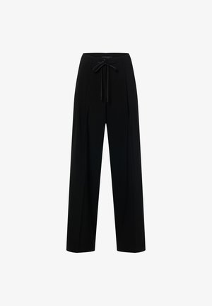 Pantalon noir à jambes larges avec taille à cordon, présentant une texture lisse et un design plissé à l'avant. Aucun accessoire métallique visible.