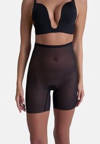 Svarta genomskinliga shaping-shorts med hög midja, med en jämn textur och en diskret öppning i botten för bekvämlighet.