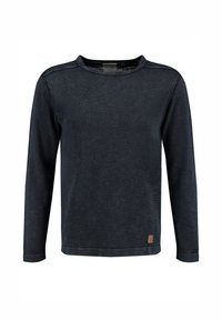 Camisa de manga larga en azul marino oscuro, con tejido texturizado. Cuello redondo, costuras de los hombros con costura de acento y un pequeño parche de cuero con el logo en el dobladillo.