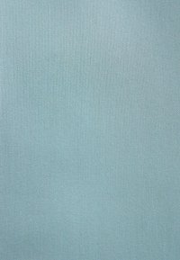 Light blue fabric featuring a subtle texture with a diagonal weave pattern, smooth surface, and consistent color throughout.