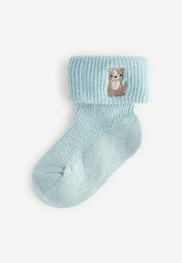 Lys blå strikket sok med ribbet manchet. Har et broderet dyremotiv på forsiden. Blød tekstur og rund tå.