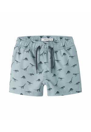 Lichtblauwe zwemshorts voor peuters met elastische tailleband, zwart trekkoord en een all-over donker dinosaurusprint.