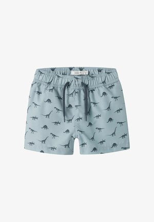 Lichtblauwe zwemshorts voor peuters met elastische tailleband, zwart trekkoord en een all-over donker dinosaurusprint.
