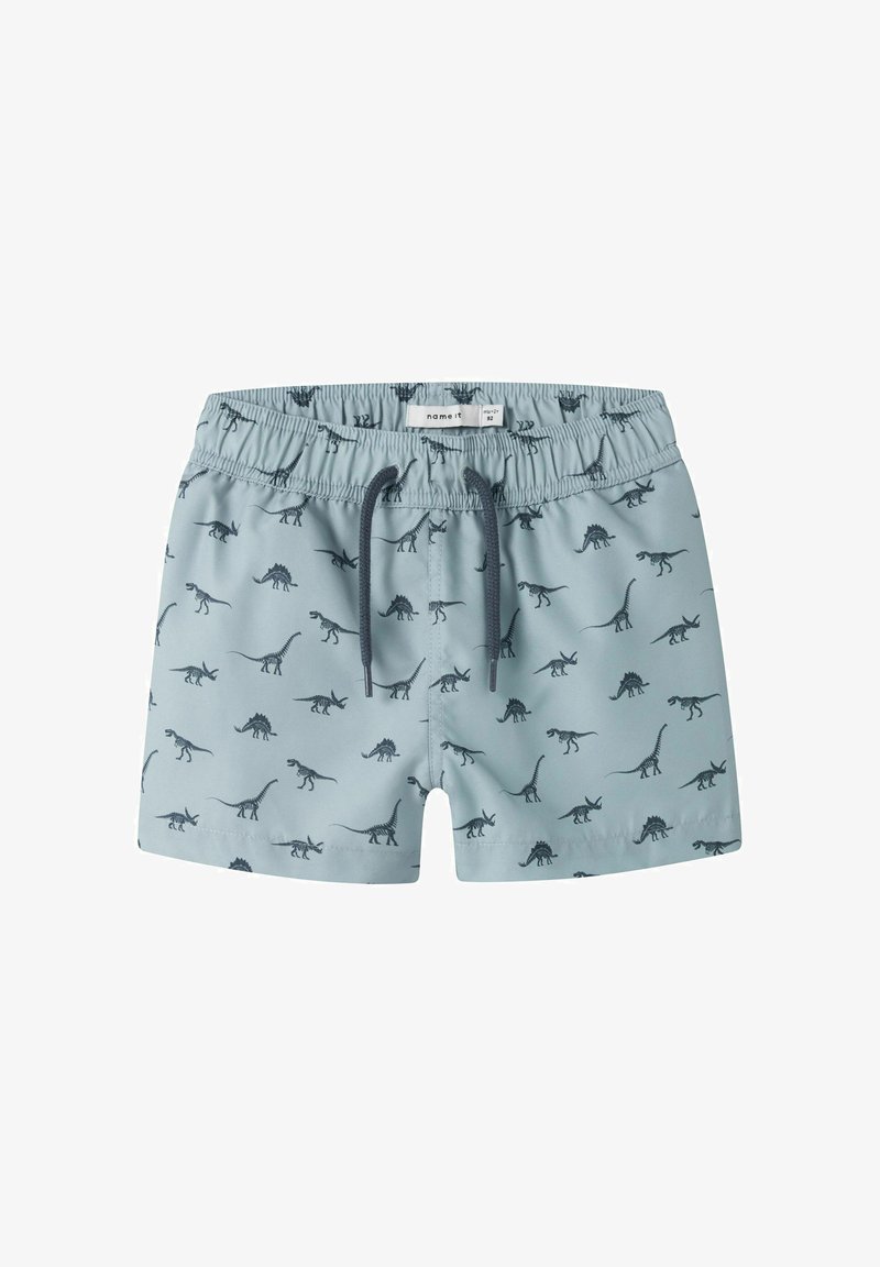 Shorts de bain bleu clair pour tout-petit avec taille élastique, cordon noir, et imprimés sombres de dinosaures sur l'ensemble.