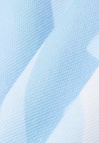 Light blue and white fabric with a textured, woven pattern featuring diagonal stripes.