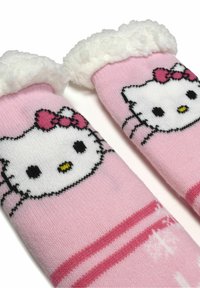 Pink socks with a Hello Kitty design, featuring white faux fur cuffs and pink stripes, made of soft material.