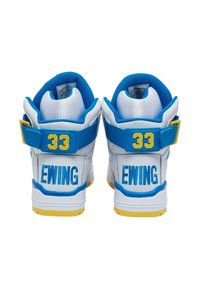 White high-top sneakers with blue accents, featuring a yellow strap and branding. Solid rubber outsole, padded collar, and mesh lining.