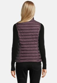 Vests in dark purple, featuring a quilted design with horizontal padding, made from smooth, lightweight fabric. Fitted with a high collar.