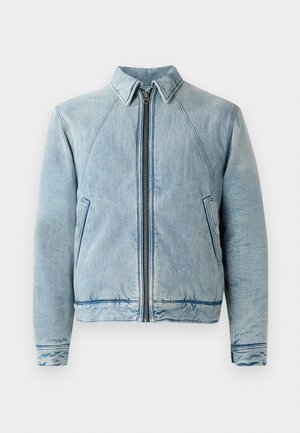 Lichtblauwe denimjack met een ritssluiting aan de voorkant, puntige kraag, raglanmouwen en twee zijzakken. Beschikt over een soepele textuur en afgewerkte zomen.