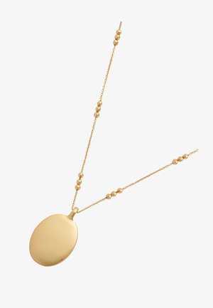 Gold necklace featuring a smooth, oval pendant on a chain with evenly spaced spherical beads. The overall design is delicate and minimalist.