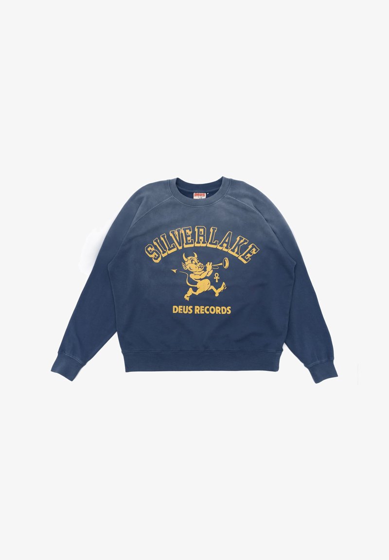Sweat-shirt bleu marine avec un motif graphique jaune comportant les mots "SILVERLAKE" et "DEUS RECORDS", ainsi qu'un personnage de dessin animé jouant de la trompette.