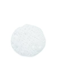 Clear, circular soap with a smooth surface covered in varying sizes of bubbles, reflecting light, on a white background.