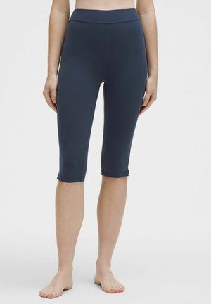 Navy blue capri leggings with a high waistband, smooth texture, and ankle-length cut, featuring a simple hem and no added embellishments.