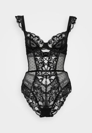 Bodysuit em renda preta com padrões florais, bolinhas e malha transparente. Os detalhes incluem bordas em forma de escalope e um design com recorte frontal.