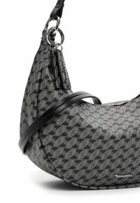 Houndstooth-kuosisolmukasa, harmaasta kankaasta, mustalla nahkahihnalla, hopeisilla yksityiskohdilla ja sileällä, jämäkällä muodolla.
