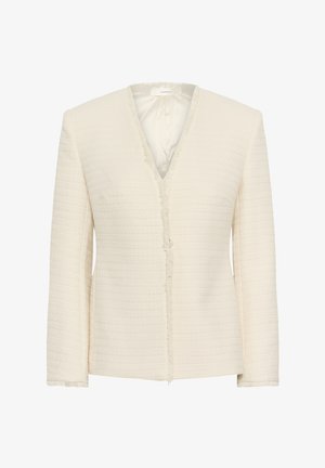 Krém színű, texturált női blézer hosszú ujjakkal, V-nyakkivágással és finom rojtos díszítéssel a szegélyeken és a mandzsettákon.