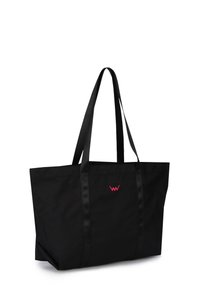 Black tote bag made of durable fabric, featuring two long handles and a small pink logo on the front. Rectangular shape with spacious interior.