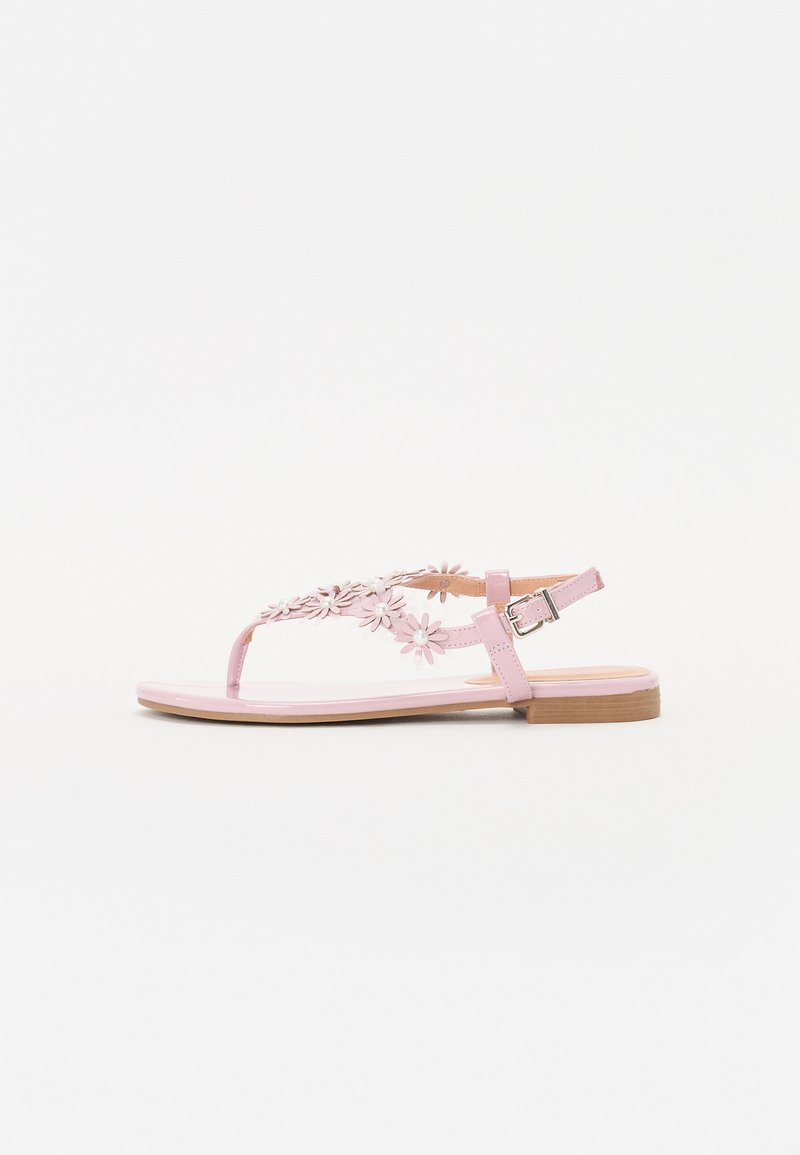 Sandálias planas cor-de-rosa com embellishments florais nas alças, feitas de material sintético liso. Apresenta um fecho de fivela e uma sola de madeira.