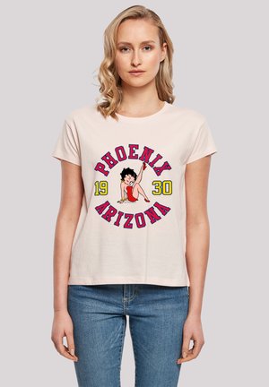 Light pink cotton t-shirt featuring a graphic of a woman with black hair and red shoes, with "PHOENIX 1930" text in red and yellow.