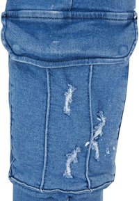 Light blue denim jeans with a relaxed fit, featuring distressed areas, frayed patches, and a soft texture. Classic five-pocket design.