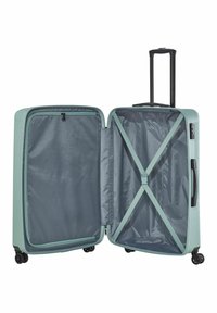 Valise rigide turquoise avec une poignée noire rétractable, double roues, et un intérieur gris comprenant des compartiments avec fermeture éclair et des sangles croisées.