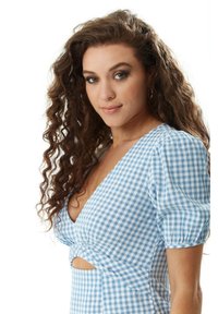 Blue and white gingham dress with puff sleeves, a deep V-neck, and cut-out details at the waist. Textured fabric with a smooth finish.