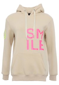 Beige hoodie with a large pink "SMILE" print on the front, drawstrings, front pocket, and a circular logo in green on the left sleeve.