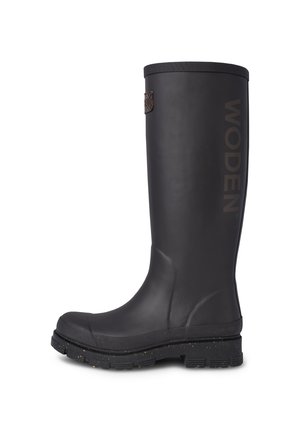 Tall black rubber boot with textured finish, WODEN logo on the side, and a reinforced sole featuring speckled accents.