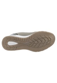 Suola della sneaker in materiale gommoso testurizzato di colore marrone chiaro con motivo a onde, dettagli bianchi e logo impressato sul lato.