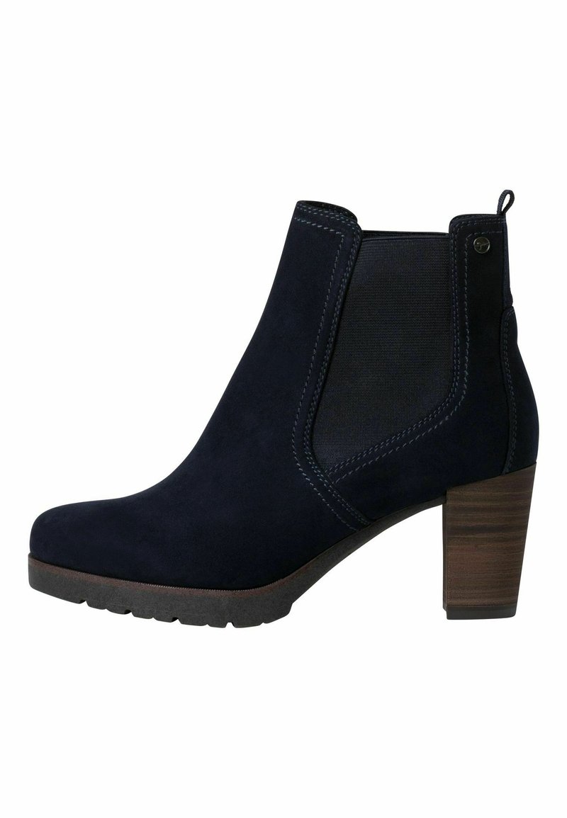 Bottine en daim bleu marine avec talon carré, panneau latéral élastique et languette de traction à l'arrière.