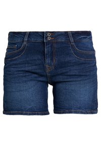 Tummansiniset farkkushortsit, joissa on keskikorkea vyötärö, kaksi etutaskua ja kaksoispainonappi. Ominaisuuksiin kuuluu hapsureuna ja kontrastivärinen ompelu.