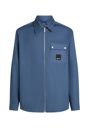 Blue zip-up shirt made of smooth fabric, featuring a chest pocket with snap closure and brand label, with a classic collar and long sleeves.
