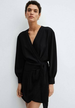 Black wrap dress with long, puffed sleeves, a tie waist, and a short hemline. Soft fabric with a smooth texture and minimalistic design.