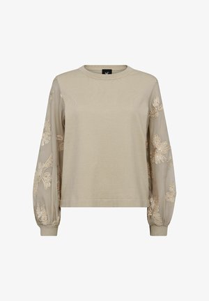 Bež pulover z rebrastim telesom in prosojnimi, vezenimi balonastimi rokavi z cvetličnimi vzorci ter zaobljenim izrezom na vratu.