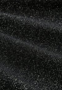 Black fabric with a textured surface, featuring sparkly silver threads woven throughout, creating a shimmering, slightly stretchy appearance.