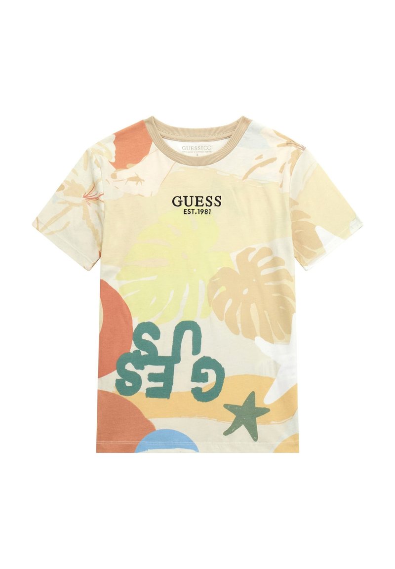 T-shirt a maniche corte in misto cotone con stampe tropicali colorate, "GUESS EST.1981" in lettere nere e design a girocollo.