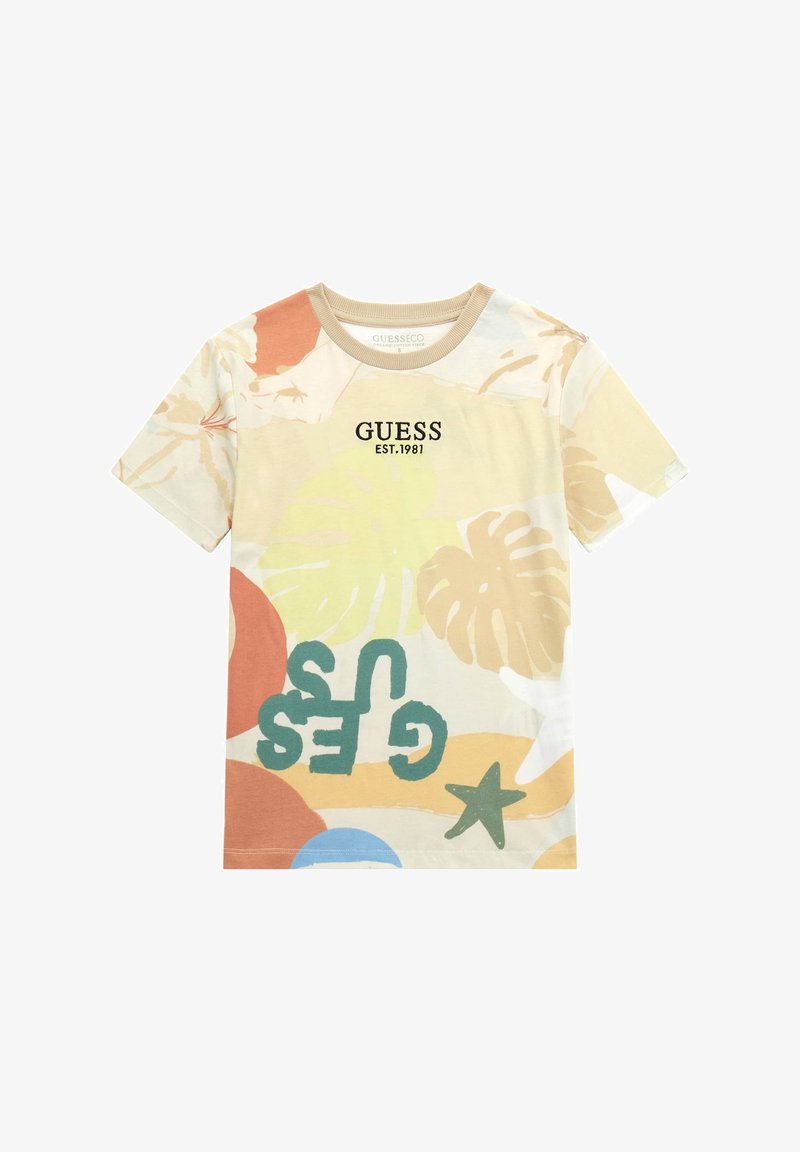 T-shirt a maniche corte in misto cotone con stampe tropicali colorate, "GUESS EST.1981" in lettere nere e design a girocollo.