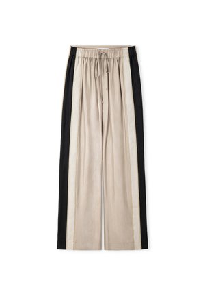 Pantalones beige de pierna ancha con franjas verticales negras y crema en los costados, cinturilla elástica y cordón delantero sobre fondo blanco.