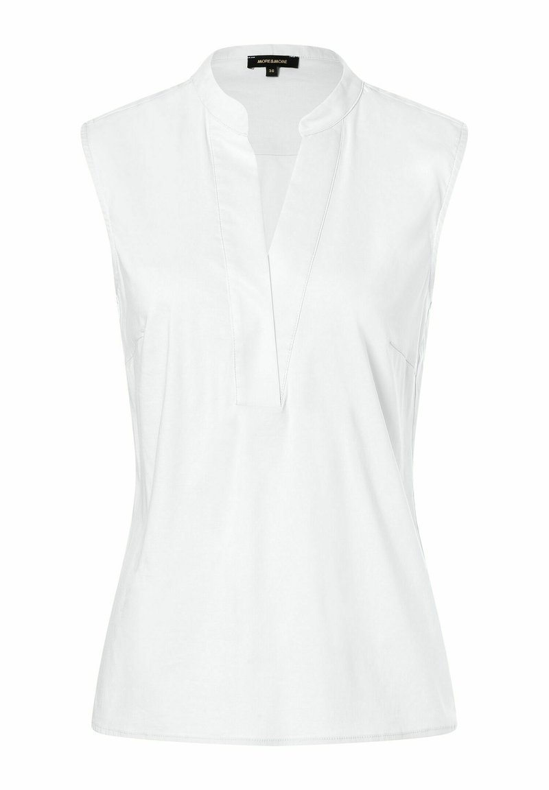 Blouse blanche sans manches avec col en V et col mandarin, réalisée en tissu lisse, conçue pour les femmes.